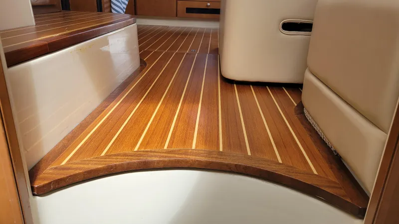 Queen Alexia Yacht Photos Pics Interior of 2005 Meridian 341 Sedan with polished wooden flooring.