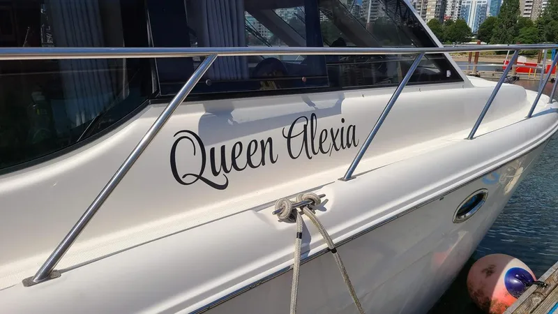 Queen Alexia Yacht Photos Pics 2005 Meridian 341 Sedan yacht named "Queen Alexia" docked at a marina.