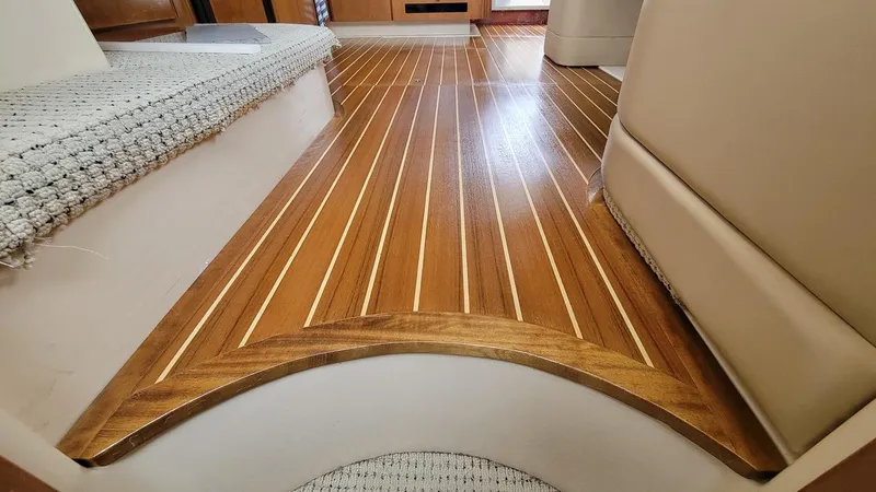 Queen Alexia Yacht Photos Pics Luxurious wooden flooring inside a 2005 Meridian 341 Sedan yacht.