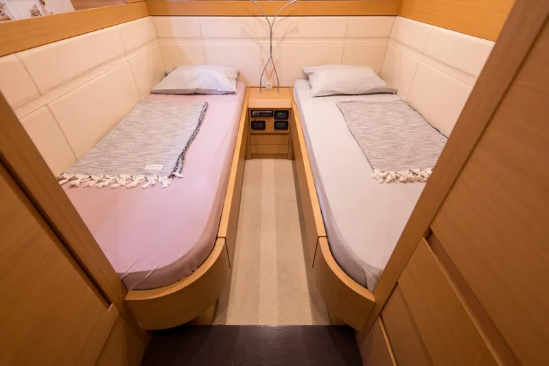 Pax Yacht Photos Pics Twin cabin interior of 2008 Pershing 64 yacht with modern wooden design.