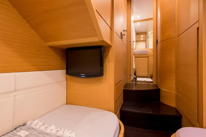 Pax Yacht Photos Pics Luxurious interior of 2008 Pershing 64 yacht with wood paneling and modern amenities.