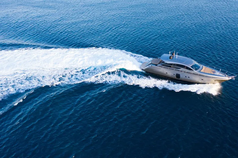 Pax Yacht Photos Pics Luxurious 2008 Pershing 64 yacht cruising on open blue sea.