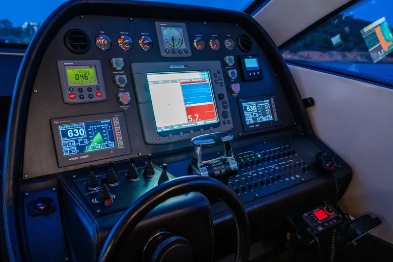 Pax Yacht Photos Pics Control panel of a 2008 Pershing 64 yacht with advanced navigation instruments.