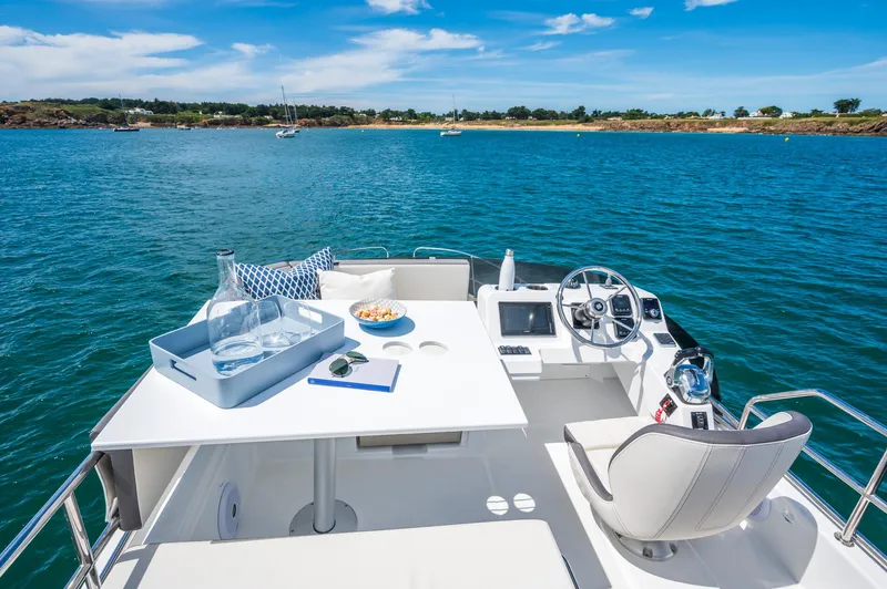  Yacht Photos Pics 2026 Beneteau Antares 11 Fly yacht, featuring a sleek deck with ocean view.