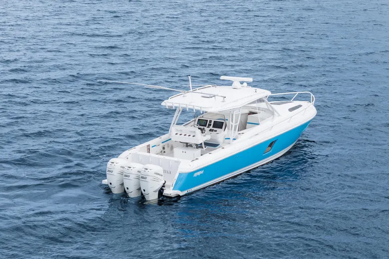  Yacht Photos Pics 2018 Intrepid 407 Cuddy boat with triple engines on open water.