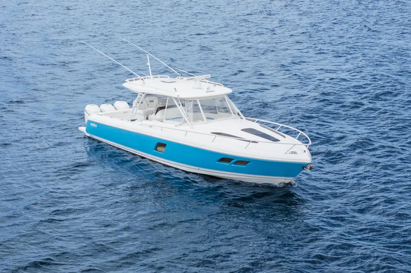  Yacht Photos Pics 2018 Intrepid 407 Cuddy boat on open blue water.