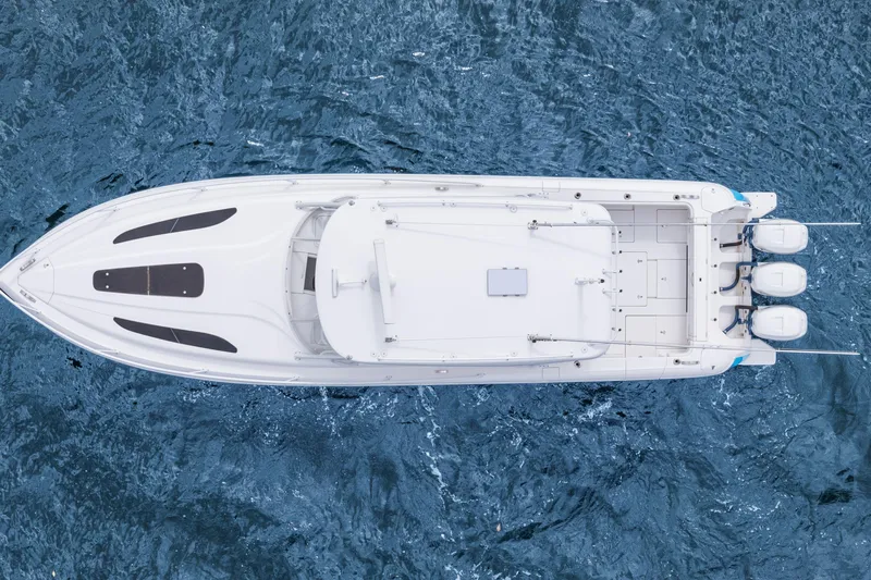  Yacht Photos Pics Overhead view of 2018 Intrepid 407 Cuddy boat on blue water.