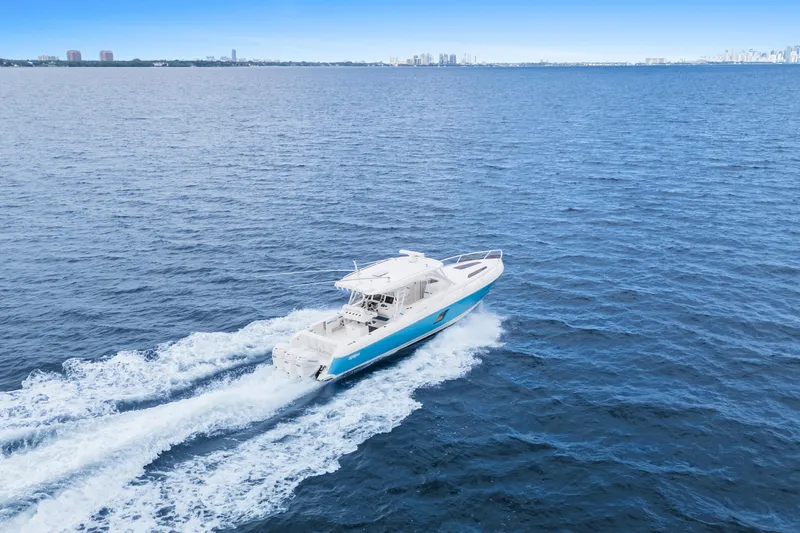  Yacht Photos Pics 2018 Intrepid 407 Cuddy cruising on open blue ocean waters.