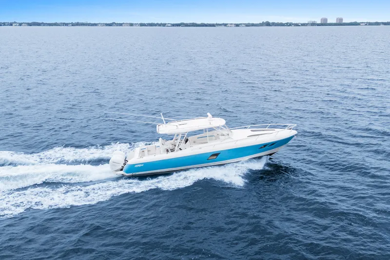  Yacht Photos Pics 2018 Intrepid 407 Cuddy cruising on open water, showcasing sleek design and performance.