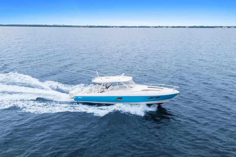  Yacht Photos Pics 2018 Intrepid 407 Cuddy cruising on open water, showcasing sleek design and performance.