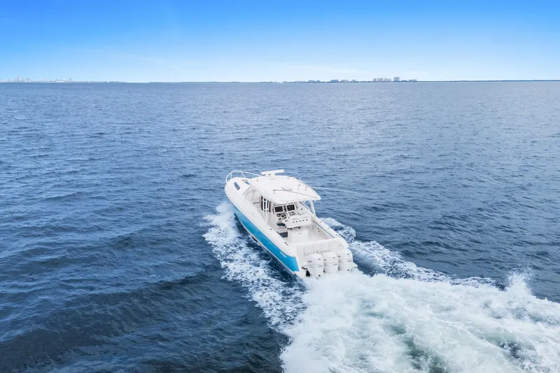  Yacht Photos Pics 2018 Intrepid 407 Cuddy cruising on open blue ocean waters.