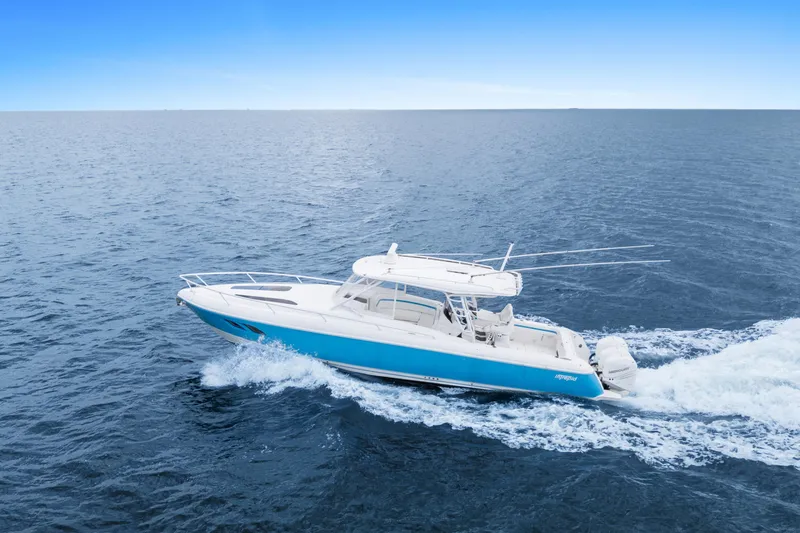  Yacht Photos Pics 2018 Intrepid 407 Cuddy cruising on open ocean under clear blue sky.