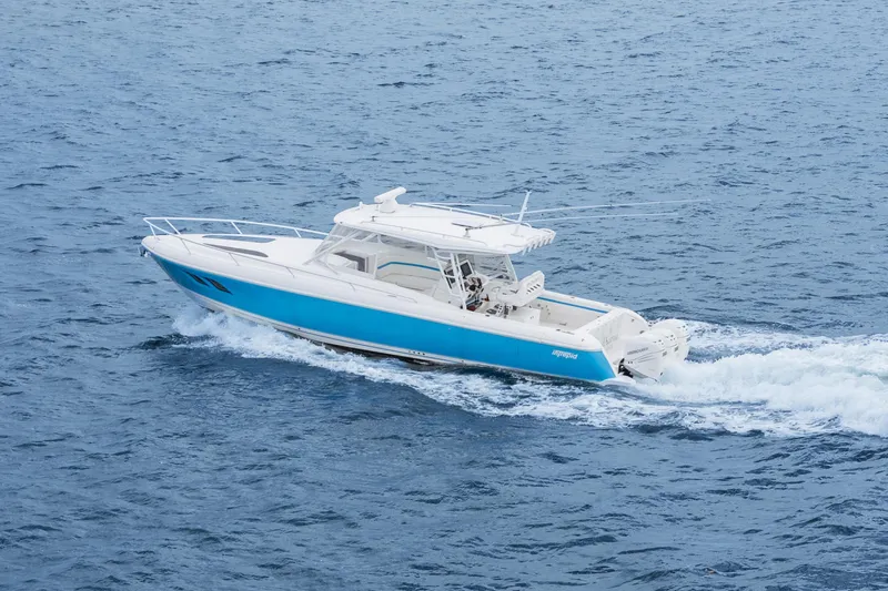  Yacht Photos Pics 2018 Intrepid 407 Cuddy cruising on open water, showcasing sleek design and performance.