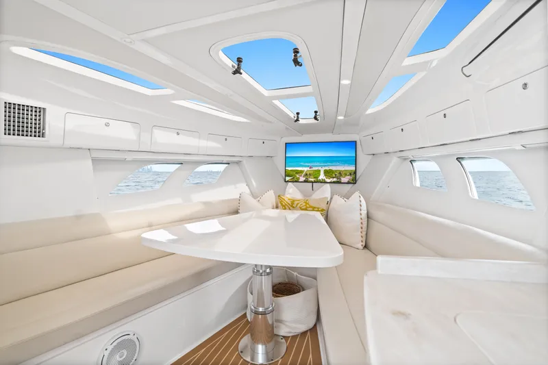  Yacht Photos Pics Luxurious interior of 2018 Intrepid 407 Cuddy boat with plush seating and ocean view.