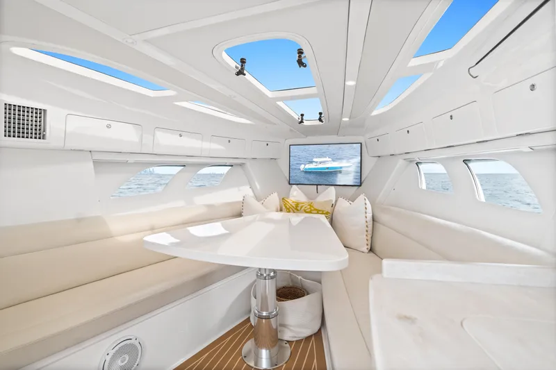  Yacht Photos Pics Luxurious interior of 2018 Intrepid 407 Cuddy boat with elegant seating and modern design.