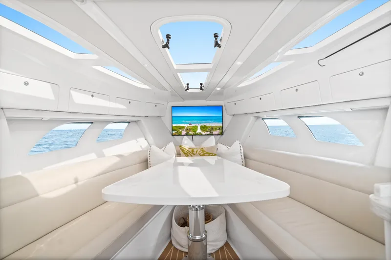  Yacht Photos Pics Luxurious interior of 2018 Intrepid 407 Cuddy boat with elegant seating and ocean view.