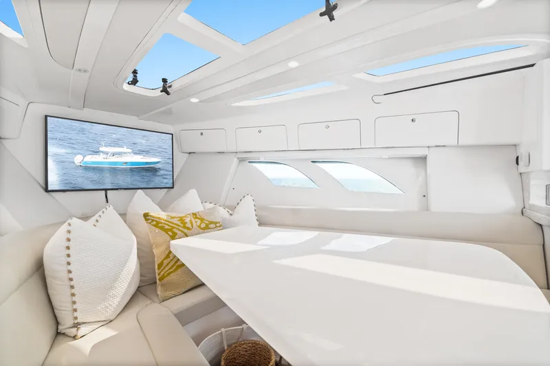  Yacht Photos Pics Luxurious interior of 2018 Intrepid 407 Cuddy with plush seating and modern amenities.