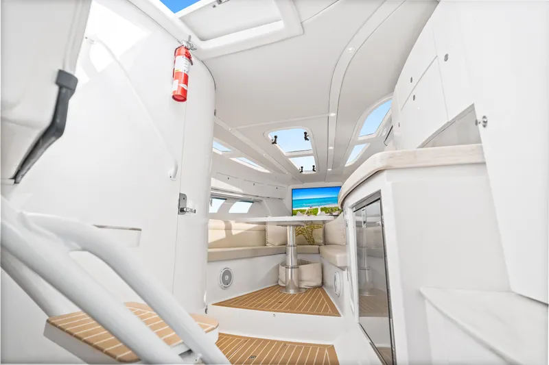  Yacht Photos Pics Interior of 2018 Intrepid 407 Cuddy boat, featuring modern design and comfortable seating.