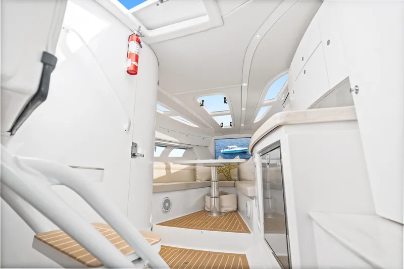  Yacht Photos Pics Interior of 2018 Intrepid 407 Cuddy boat, featuring modern design and comfortable seating.
