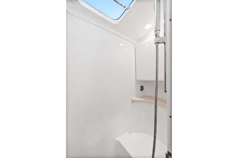  Yacht Photos Pics 2018 Intrepid 407 Cuddy boat interior shower with modern fixtures and natural light.