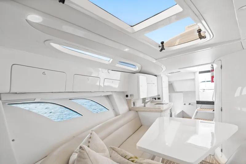  Yacht Photos Pics Luxurious interior of 2018 Intrepid 407 Cuddy boat with modern design and ample natural light.