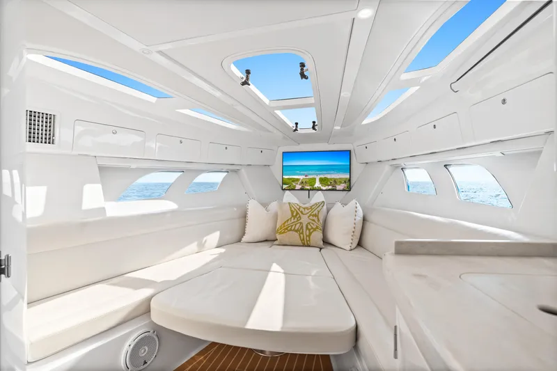  Yacht Photos Pics Luxurious interior of 2018 Intrepid 407 Cuddy boat with plush seating and ocean view.