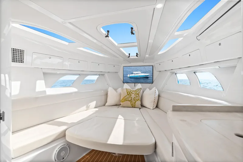  Yacht Photos Pics Luxurious interior of 2018 Intrepid 407 Cuddy boat with plush seating and ocean view.
