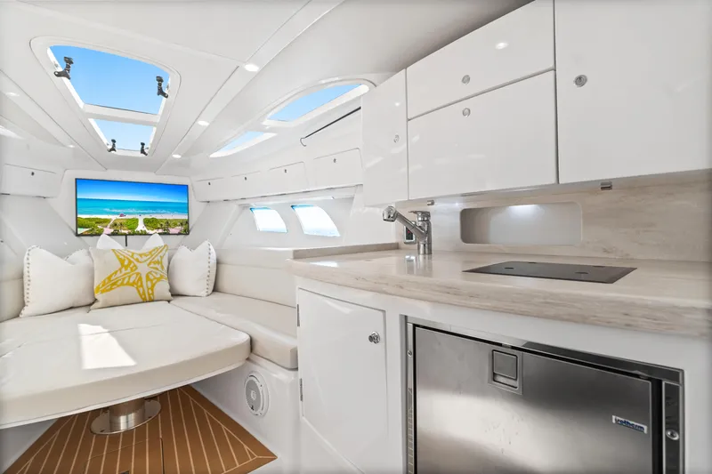  Yacht Photos Pics Luxurious interior of 2018 Intrepid 407 Cuddy boat with modern amenities and elegant design.