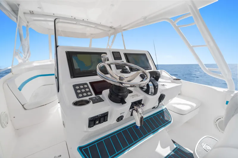  Yacht Photos Pics 2018 Intrepid 407 Cuddy helm with modern controls and ocean view.