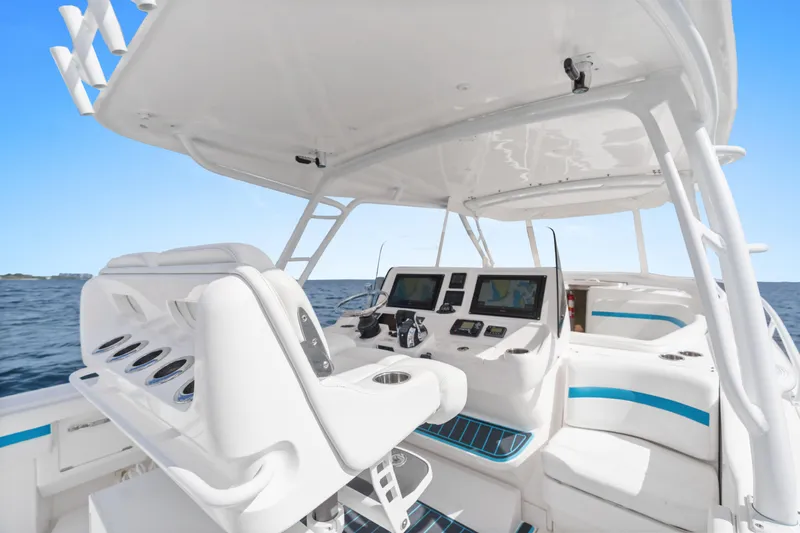 Yacht Photos Pics 2018 Intrepid 407 Cuddy boat interior with modern helm and seating on open water.