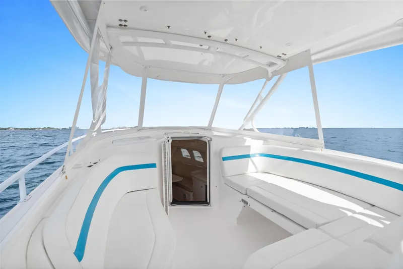  Yacht Photos Pics 2018 Intrepid 407 Cuddy boat interior with white seating and ocean view.
