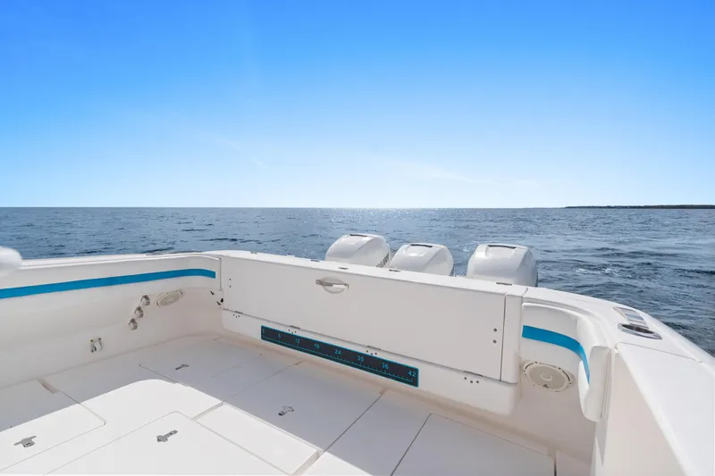  Yacht Photos Pics 2018 Intrepid 407 Cuddy boat deck with ocean view under clear blue sky.