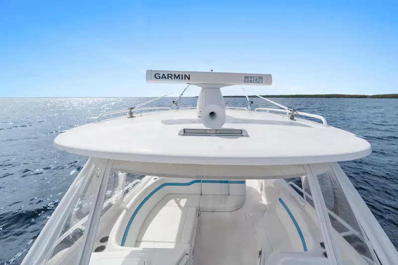  Yacht Photos Pics 2018 Intrepid 407 Cuddy boat with Garmin radar on open water under clear blue sky.