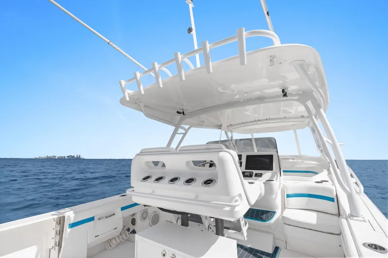  Yacht Photos Pics 2018 Intrepid 407 Cuddy boat interior with ocean view and clear blue sky.