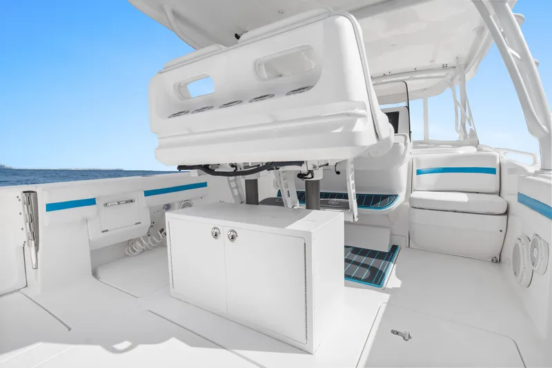  Yacht Photos Pics 2018 Intrepid 407 Cuddy boat interior with white seating and blue accents.