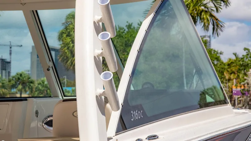  Yacht Photos Pics 2023 Sailfish 316 DC boat with rod holders and windshield.