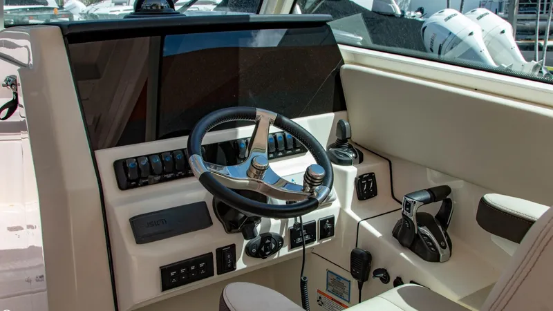  Yacht Photos Pics 2023 Sailfish 316 DC boat helm with modern controls and steering wheel.