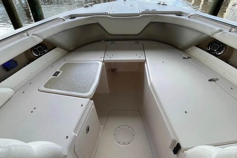  Yacht Photos Pics 2014 Grady-White Freedom 335 boat interior with spacious seating and storage compartments.