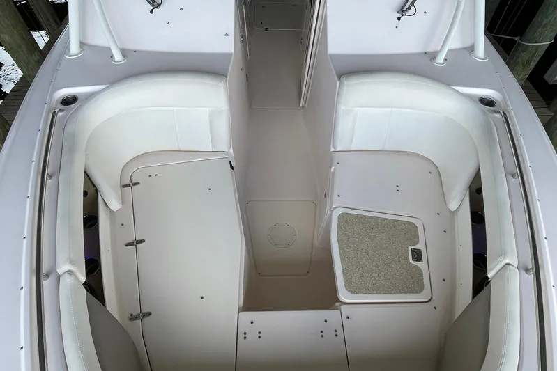  Yacht Photos Pics 2014 Grady-White Freedom 335 boat interior with white seating and storage compartments.