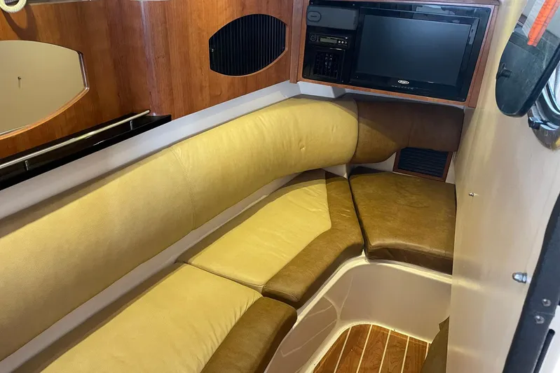  Yacht Photos Pics 2014 Grady-White Freedom 335 cabin interior with seating and entertainment system.