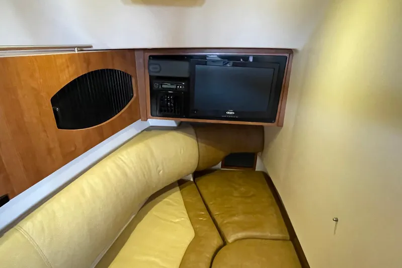  Yacht Photos Pics Interior cabin of 2014 Grady-White Freedom 335 with TV and seating area.