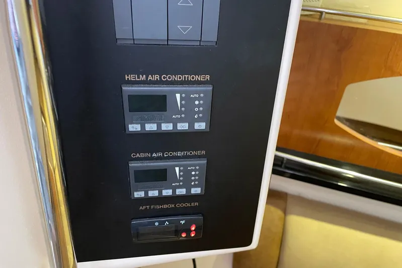  Yacht Photos Pics Control panel for helm and cabin air conditioning on 2014 Grady-White Freedom 335 boat.