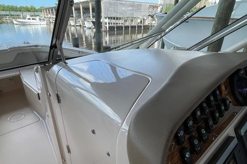  Yacht Photos Pics 2014 Grady-White Freedom 335 boat dashboard with marina view in background.