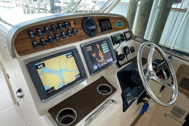  Yacht Photos Pics 2014 Grady-White Freedom 335 helm with navigation screens and controls.
