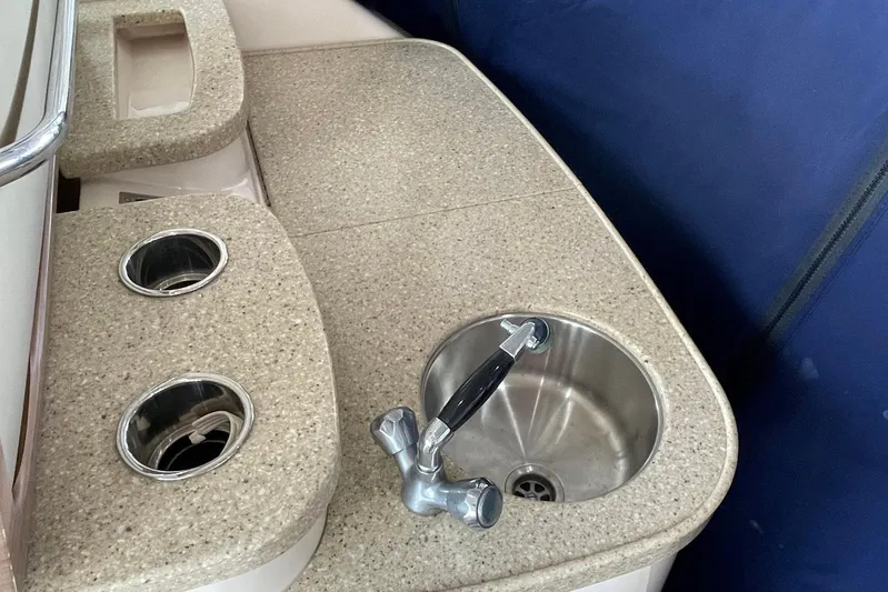  Yacht Photos Pics 2014 Grady-White Freedom 335 boat sink and countertop with cup holders.