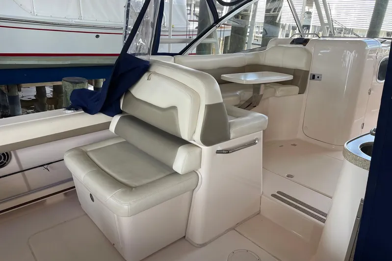  Yacht Photos Pics 2014 Grady-White Freedom 335 boat interior with seating and table setup.