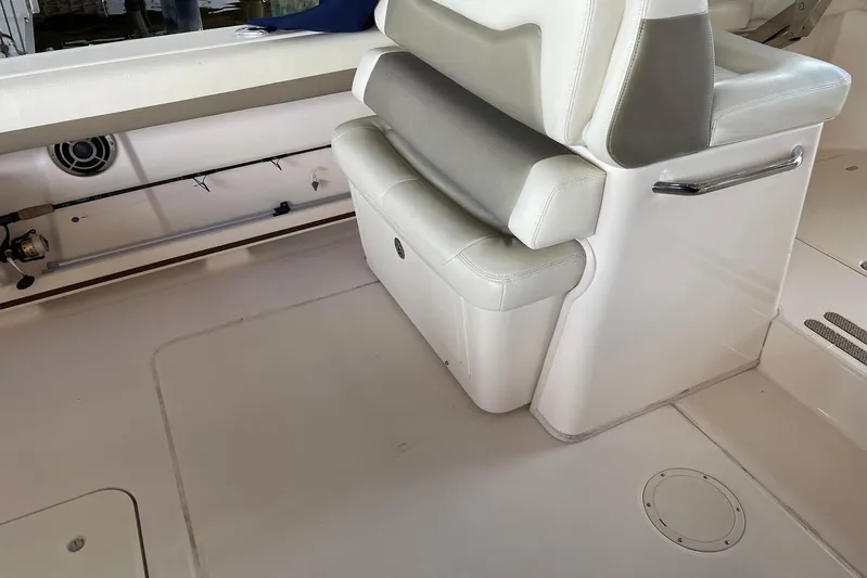  Yacht Photos Pics 2014 Grady-White Freedom 335 boat interior with white seating and storage.