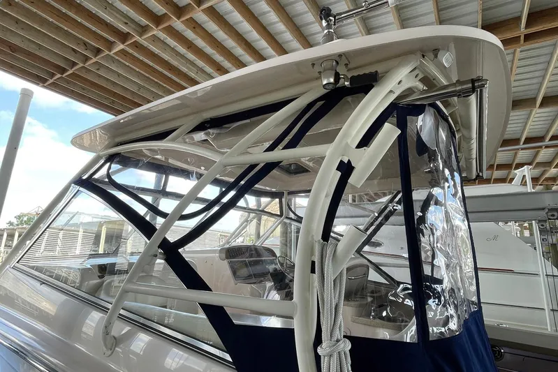  Yacht Photos Pics 2014 Grady-White Freedom 335 boat with protective canopy and clear side panels.