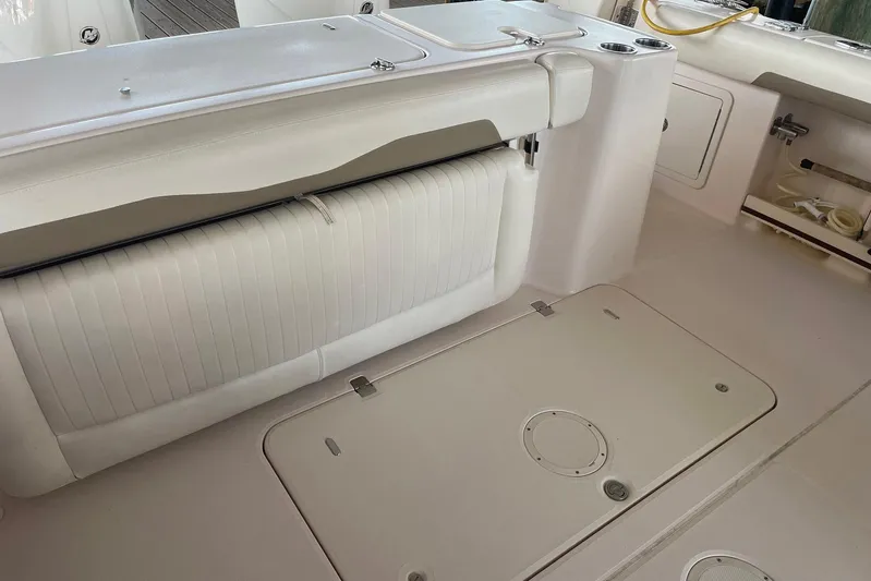  Yacht Photos Pics 2014 Grady-White Freedom 335 boat interior with white seating and storage compartments.