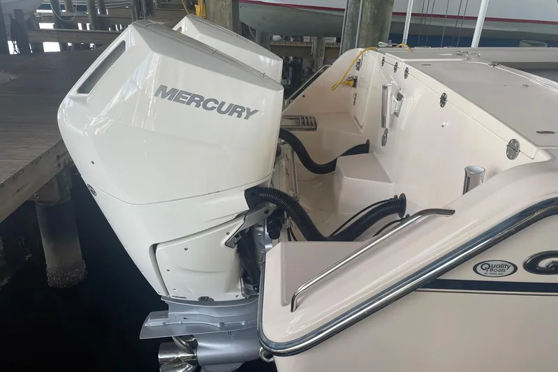  Yacht Photos Pics 2014 Grady-White Freedom 335 boat with Mercury outboard engine at dock.